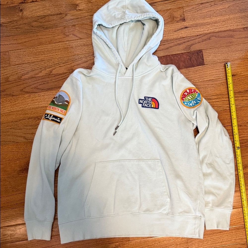 The North Face Light Blue Hoodie with Multicolor Patches